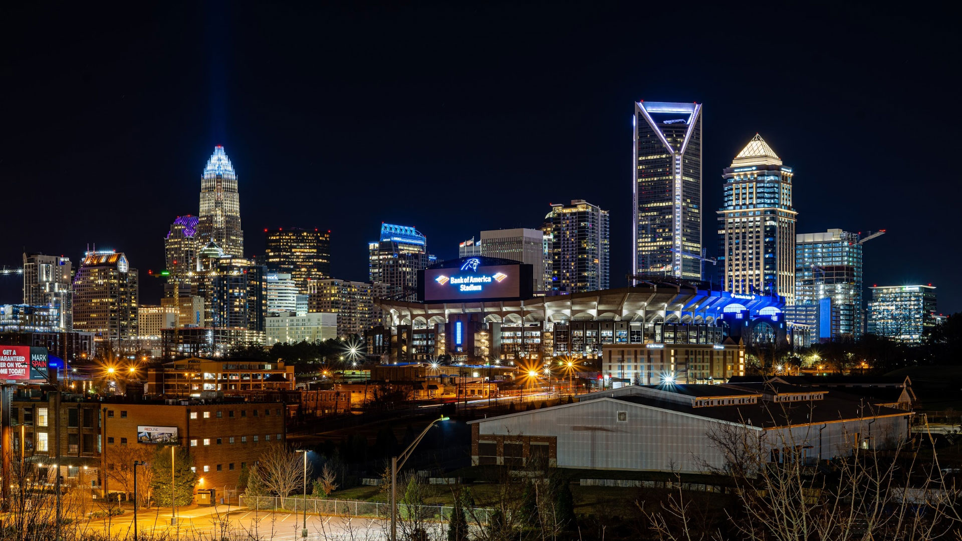 City skyline at night with building and street lighting