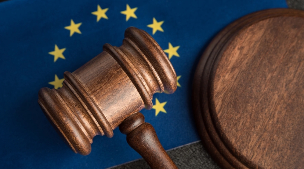 Image of a gavel over the European Union flag